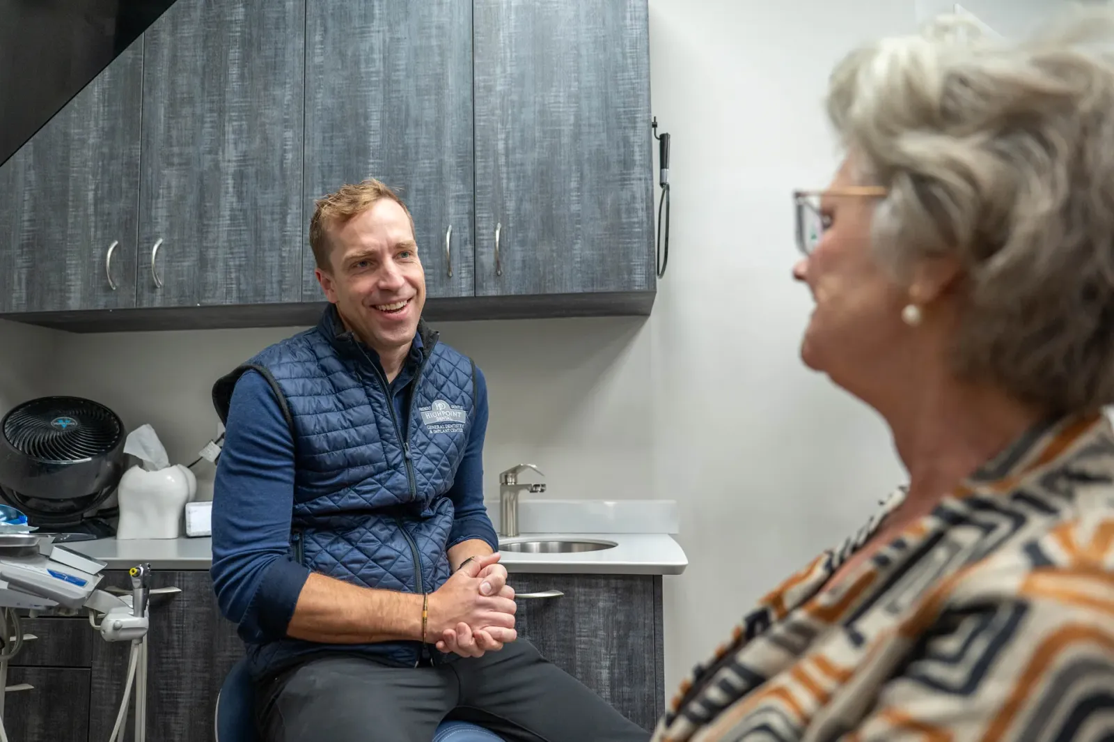 A Highpoint Dental dentist discussing treatment options with a patient
