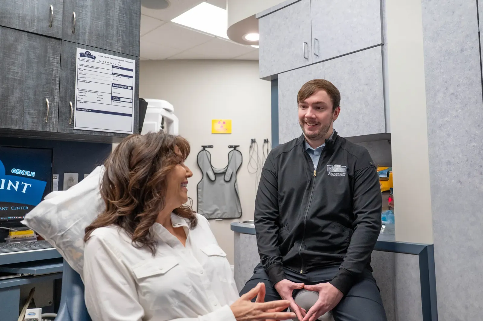 A dentist examining a patient during an urgent visit
